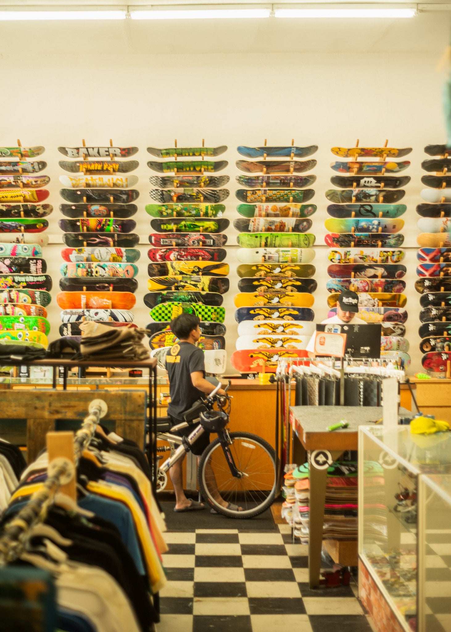 Inside LA Skate Co — decks and roller skates on the wall